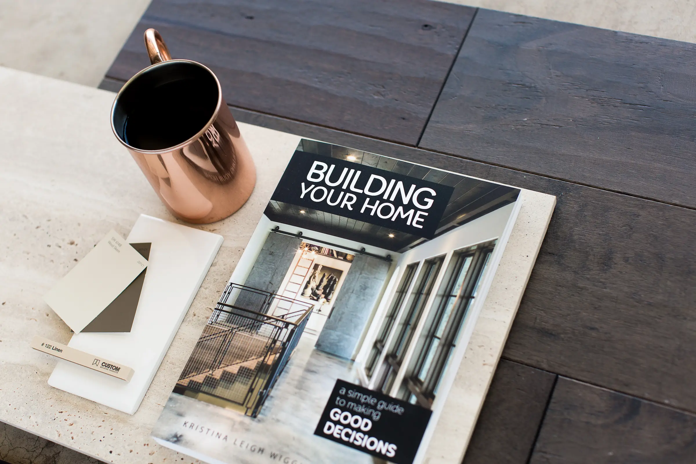 coffee table with book and copper mug